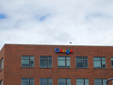 SEATTLE, WASHINGTON/USA - June 24, 2016: Outside View of Google Logo on red brick Office Building...