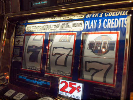 LAS VEGAS, NEVADA, USA - SEPTEMBER 10: Close-up of slot machine with a near hit of 7's in Casino on September 5, 2010 in Las Vegasのeditorial素材