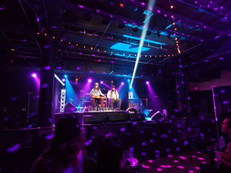 HONOLULU, HI - JUNE 15: Tavana and Keith Batlin play guitar and sing on stage at Crossroads in Hawaiian Brian's on June 15 2016, Honolulu, Hawaii.のeditorial素材