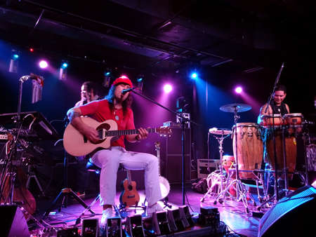 HONOLULU, HI - JANUARY 31: Musician Tavana play guitar and sing on stage at Crossroads in Hawaiian...