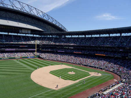 SEATTLE - JUNE 26: Mariners Pitcher steps forward to throw pitch to Cardinals batter with infield in view during baseball game at Safeco Field, Seattle in June 26, 2016.のeditorial素材
