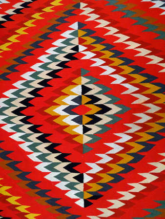 Pattern Red, Orange, White, Green, Black, and blue Diamond Blanket/ Rug - Navajo Artist, made about 1885 of cotton and wool.                              の写真素材