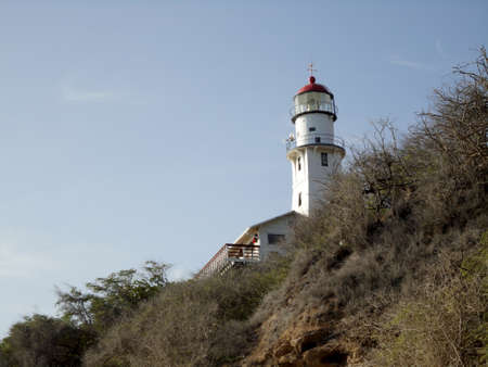Diamond Head Lighthouse on Oahu.  Diamond Head Lighthouse is a United States Coast Guard facility located on Diamond Head in Honolulu, on the island of OÊ»ahu in the State of HawaiÊ»i. The lighthouse was listed on the National Register of Historic Places in 1980.の写真素材