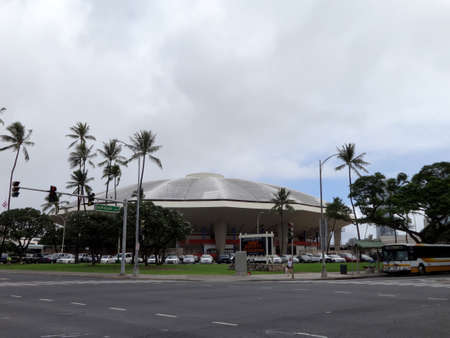 Honolulu - December 11, 2013: Iconic concert hall the Neal Blaisdell Arena and Honolulu Bus with Jimmy Buffett ad on digital board in Honolulu, Hawaii.のeditorial素材