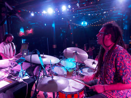 Honolulu, HI - December 30, 2017: Musician Jerome James and Activ8 Electro Jazz music journey and dance party on stage at Crossroads in Hawaiian Brian's with cool lighting on December 30, 2017, Honolulu, Hawaii.のeditorial素材