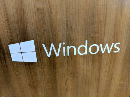 Honolulu - December 14, 2017: Microsoft Windows Logo on Wood grain panel inside Best Buy Store.