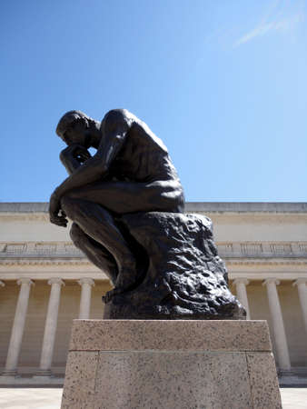 San Francisco - April 8, 2011:  Side profile of the masterpiece the Thinker by Rodin - The Thinker at the entrance of the Palace of the Legion of Honor in San Francisco.      のeditorial素材