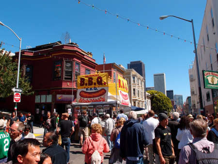 San Francisco - June 16, 2013: People hangout and walk around on street with BBQ booth at North Beach Festival Street fair San Francisco, CA.  In its 59th year, The North Beach Festival is considered one of the country's original outdoor Festivals.のeditorial素材