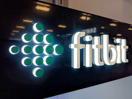 Honolulu - September 7, 2018: Fitbit Logo on wall in Honolulu Best Buy store. Fitbit, Inc. is an American company headquartered in San Francisco, California. Its products are activity trackers, wireless-enabled wearable technology devices that measure datのeditorial素材