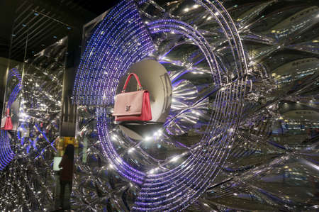 Honolulu - November 26, 2015:  Louis Vuitton window Display with LED Lights in display.  Louis Vuitton Malletier, commonly referred to as Louis Vuitton, or shortened to LV, is a fashion house and luxury retail company founded in 1854 by Louis Vuitton.のeditorial素材