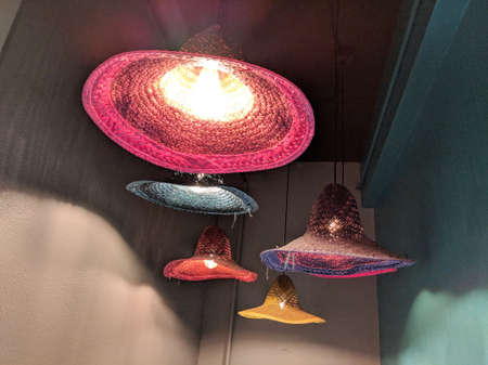 Waikiki - June 9, 2018:  Light made of mexican hats in Entrance to OMG - OAHU MEXICAN GRILL.  Casual, beachfront eatery featuring burritos, tacos & other Mexican eats, plus slushie margaritas.のeditorial素材