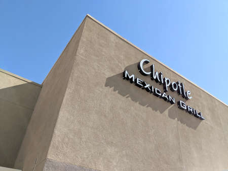 Palm Springs, California, United States - October 26, 2018: Chipotle Mexican Grill Sign on building. With more than 1600 locations, Chipotle had a net income in 2013 of US$327.4 million and a staff of more than 45,000 employees.のeditorial素材