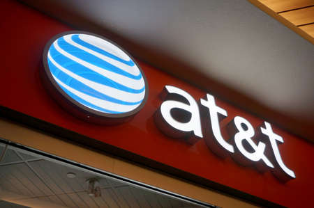 Honolulu - November 26, 2015:  at&t Logo sign on wall above store in Ala Moana Mall.  AT&T Mobility LLC, also known as AT&T Wireless, marketed as simply AT&T, is a wholly owned subsidiary of AT&T Inc. that provides wireless services to 138.8 million subscのeditorial素材