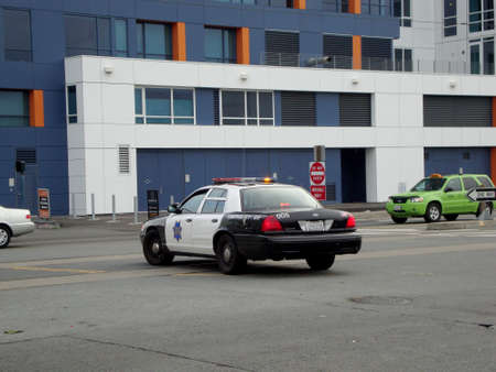 San Francisco, California - January 16, 2010:  Ford Crown Victoria SFPD Police vehicle parked in the middle of King Street during traffic incident investigation.のeditorial素材