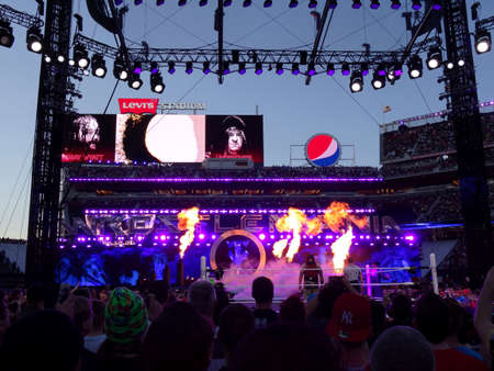 SANTA CLARA - MARCH 29: Fire shoots into the air as WWE Wrestler the Undertaker enters arena heading towards the ring with Bray Wyatt standing in that ring for match at Wrestlemania 31 at the Levi's Stadium in Santa Clara, California on March 29, 2015.のeditorial素材