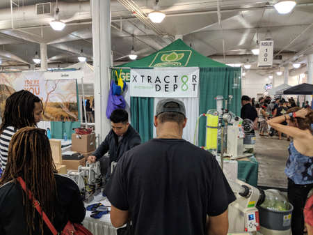 Honolulu - February 10, 2018: People check out the Extractor Depot booth at the 3rd Annual Hawaii...