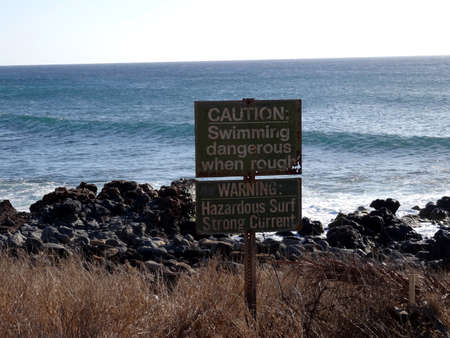 Rocks line Kepuhi Beach with Coconut trees along the shore on the island of Molokai in the state of Hawaiiの写真素材