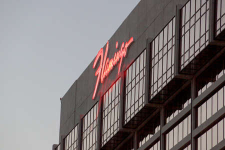 Las Vegas, Nevada - June 27, 2015: The famous Flamingo Hotel with iconic neon signs on top of hotel at dawn. It was the third resort to open on the Strip & the oldest resort on the Strip still in operation.のeditorial素材
