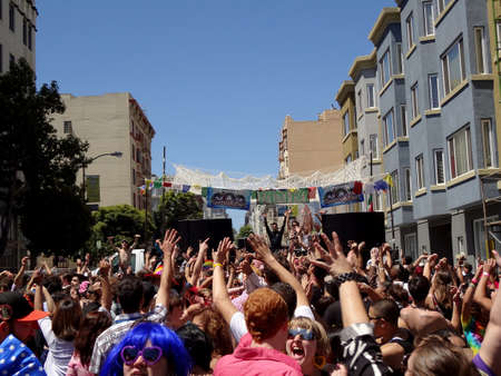San Francisco - June 25, 2011: People wae arms in air during San Francisco LovEvolution Concert in the Street.のeditorial素材