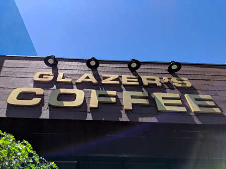 Honolulu - June 27, 2018: Grazers Coffee Sign with lense flare.のeditorial素材
