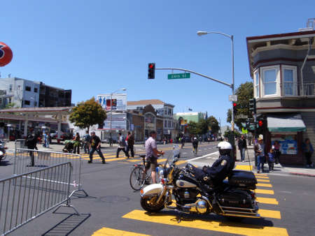 San Francisco - : SFPD Police Officer rest on Motorcycle during San Francisco Street Event.のeditorial素材