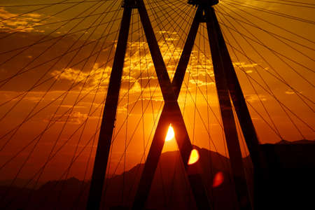 Las Vegas, Nevada - June 27, 2015: Sunrise through The High Roller Wheel at dawn at the center of...