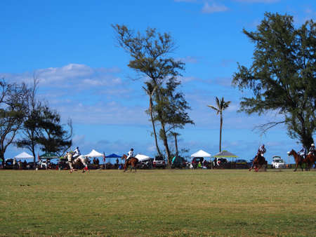 Oahu, Hawaii - May 29, 2017:  Polo Game in Action.  Established in 1963, the world-renowned Hawaii Polo Club, located in Mokuleia on the pristine North Shore, has provided a unique and exceptional venue for the game of kings to share the passion and lifesのeditorial素材
