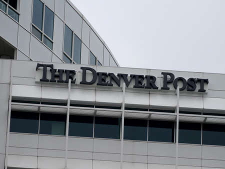 Denver - July 7, 2015: The Denver Post - Sign on top of building.  The Denver Post is a daily newspaper and website that has been published in the Denver, Colorado, area since 1892.のeditorial素材