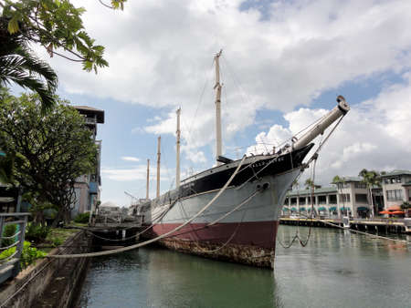 Honolulu - December 13, 2011: Historic Falls of Clyde Ship sits in Honolulu Harbor. Falls of Clyde is the last surviving iron-hulled, four-masted full rigged ship, and the only remaining sail-driven oil tanker. Designated a U.S. National Historic Landmarkのeditorial素材