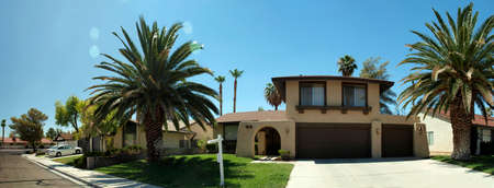 Las Vegas Home with large royal palms and three car garage.  Taken with a wide angle lens.