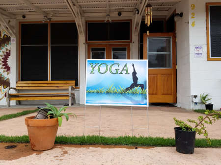 Honolulu - August 23, 2016:  Yoga sign at Hikina Yoga Studio in Honolulu, Hawaii.のeditorial素材