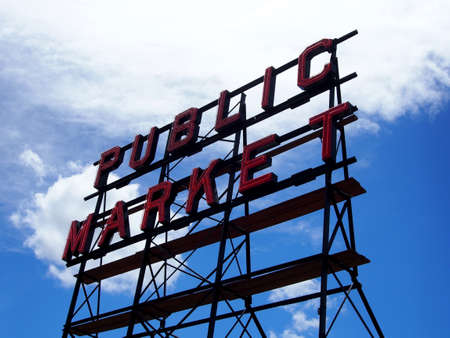 Seattle, Washington - May 18, 2019: Pike place Public market and City Fish Market neon signs on top of building at during the day.のeditorial素材