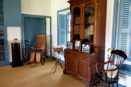 Lahaina - September 30, 2014: Inside Baldwin Home Museum, featuring items dating back to the mid-1800s like books and chairs, which is the oldest house still standing on the island of Maui.のeditorial素材