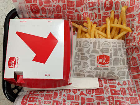 Honolulu - January 21, 2019: Jack in the Box Burger in a Box and French Fries with white paper...