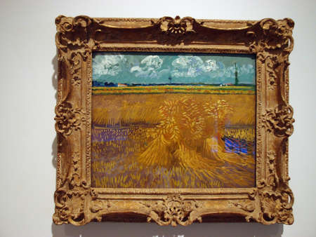 Honolulu - February 5, 2013: Vincent Van Gogh - Wheat Field.  The Wheat Fields is a series of dozens of paintings by Vincent van Gogh, borne out of his religious studies and sermons, connection to nature, appreciation of manual laborers and desire to provのeditorial素材