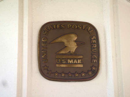 Honolulu - April 22, 2010: United States Postal Service Emblem on side of buidling on Oahu, Hawaii.のeditorial素材
