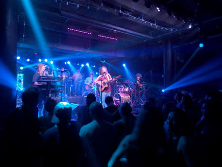 Honolulu - February 22, 2018: Mike Love Band plays music indoors with cool lighting at Crossroads at Hawaiian Brians in Honolulu, Hawaii.のeditorial素材