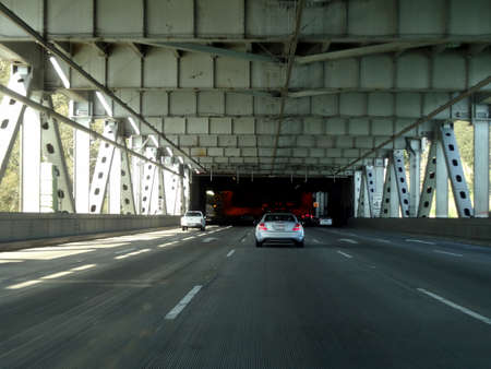San Francisco - May 4, 2011: Cars and Trucks drive on Bay Bridge lower deck on their way to Oakland,...