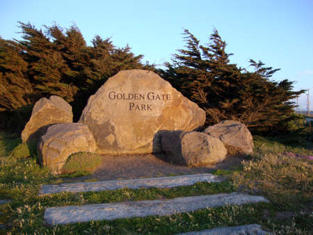 San Francisco - May 22, 2010: Golden Gate Park Sign carved into a rock at the entrance to the park at dusk.のeditorial素材