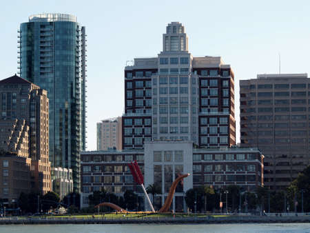 San Francisco -  August 18 2010: Cupid's Span a Large, contemporary sculpture depicting Cupid's bow, situated on a lawn and Gap Headquarters Building seen from the water.のeditorial素材