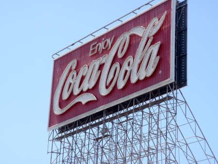 San Francisco - June 29, 2009: Enjoy Coca-Cola Neon Sign during the day against a blue sky.  The display, located at 701 Bryant St. (Bryant and 5th St.) and near San Francisco's famed flower market. Historic sign was up for 75 years before updating.のeditorial素材