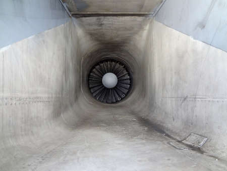 Close up Metal Tube with turbine and fan blades of a fighter jet engine with signs of wear.の写真素材