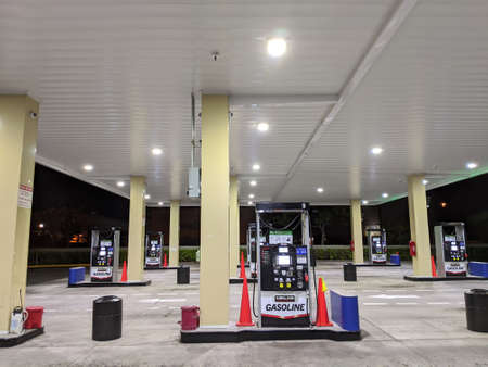 Honolulu - June 18, 2020:  Empty Costco Gasoline station at night during the Covid-19 lockdown. Costco Gasoline Significantly reduces harmful pre-existing deposit buildup on critical engine components. Restores fuel economy. Protects fuel injectors and inのeditorial素材