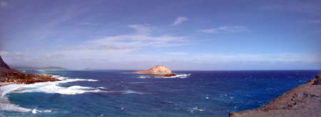 Waves crash on Makapuu Beach with the Koolau Range Mountains above looking towards Waimanalo Bay on the Windward coast of Oahu, Hawaii.  December 2010の写真素材