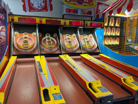 Honolulu - September 15, 2019:  Four Skee-Ball tables for play in arcade at Chuck E. Cheese.   It is...