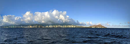 Panoramic of Waikiki, Honolulu, Hotels and Diamond Head Crater during dusk seen from the ocean on Oahu, Hawaii.の写真素材