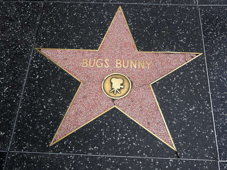 Hollywood, California - October 16, 2019: Animated Bugs Bunny star with Movie Logo on Hollywood Walk of Fame. This star is located on Hollywood Blvd. and is one of 2700 celebrity stars.のeditorial素材