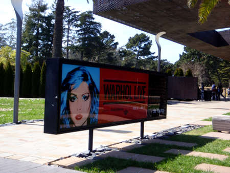San Francisco - March 31, 2009:  Warhol Live presented by Bank of America Ad on sign in De Young Garden.のeditorial素材