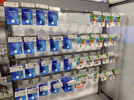 Honolulu - August 19, 2019:  Apple Itunes App Store and Google Play Gift Cards on display on rack at Best Buy.のeditorial素材