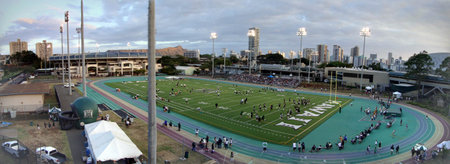 Manoa, Hawaii - April 30 2010:  Aerial of University of Hawaii Practice football game at Clarence T.C. Ching Athletics Complex on the Manoa Campus with baseball stadium and Diamond Head Crater in the distance.のeditorial素材